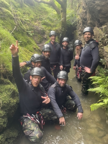 Group ghyll scrambling on a military stealth day