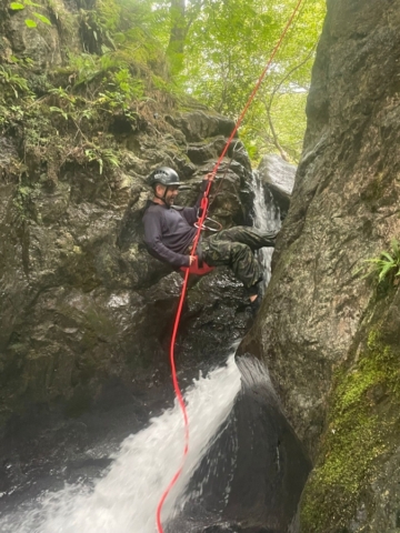 Abseiling down a waterfall in the Lake District